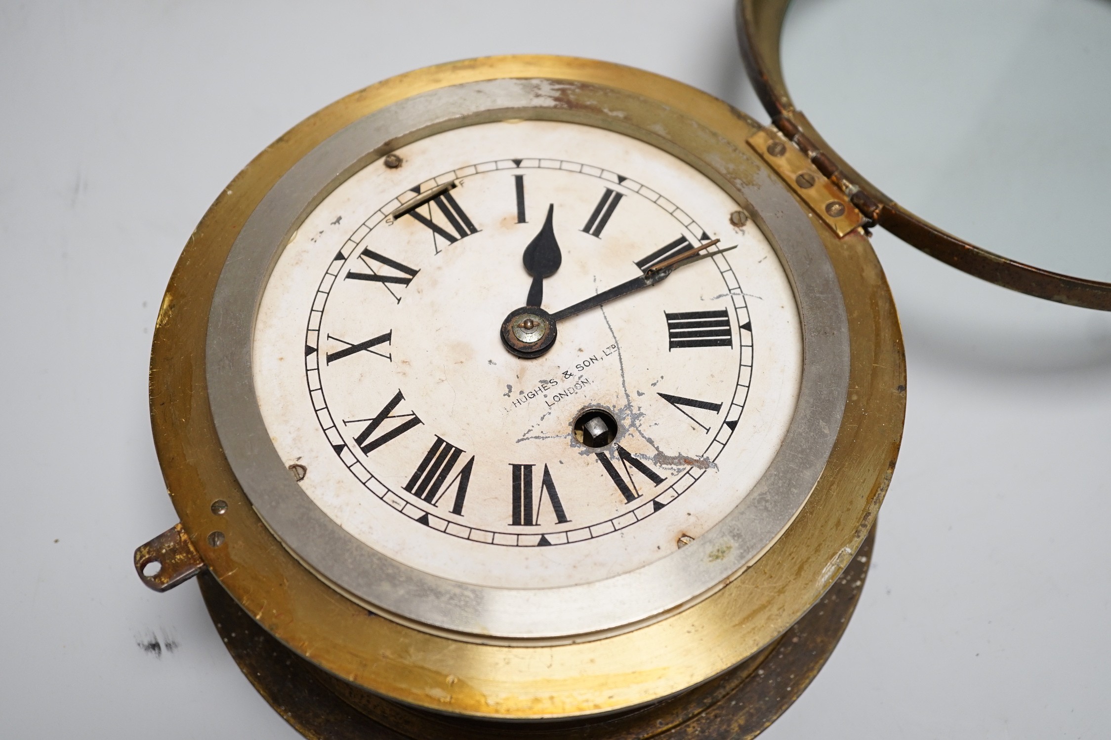 A Hughes & Son brass cased ship's clock, 19.5cm